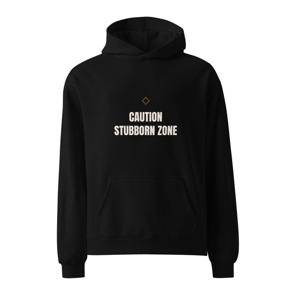Hoodie that says Stubborn Zone Caution