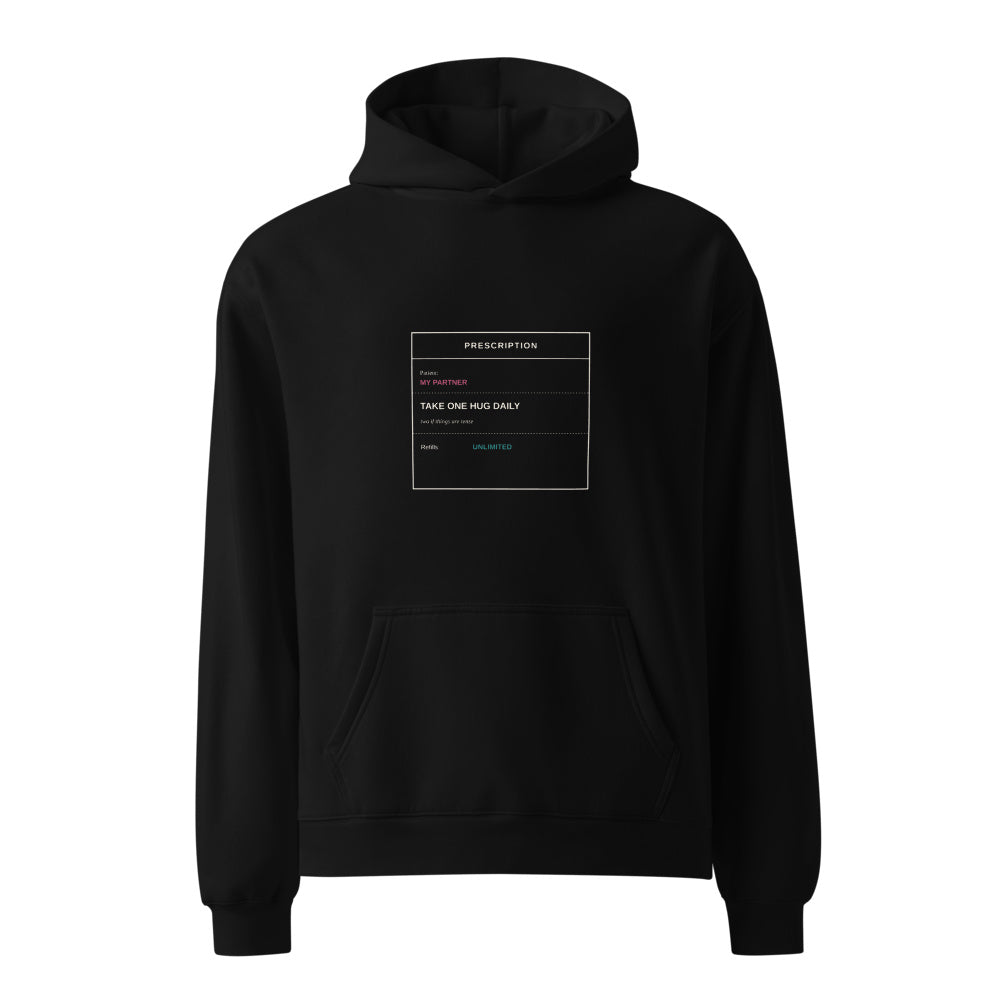 Take One Hug Daily Two If Tense black hoodie front in white studio | Kreativ